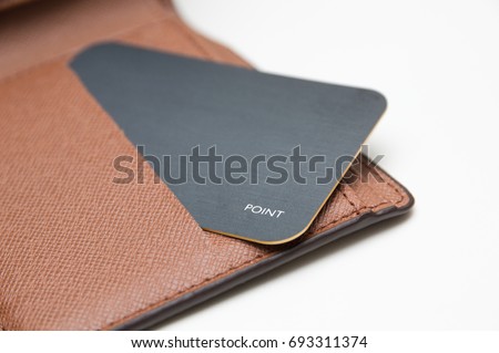 card in wallet on white background