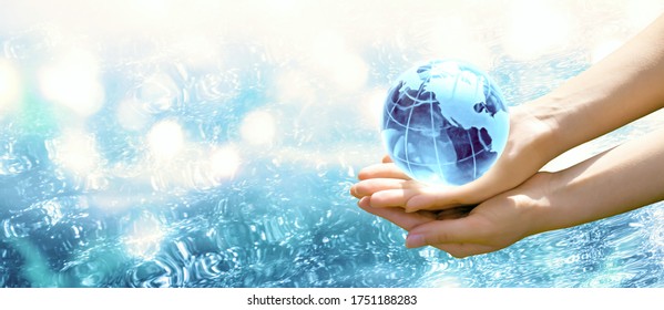 Card for World Oceans Day or Water Day. Saving environment, save, protect clean planet and ecology, sustainable lifestyle concept. Blue planet crystal glass globe in human hand on pure sea background.