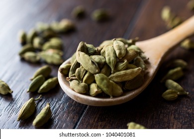 Cardamom Seeds In Wooden Spoon.