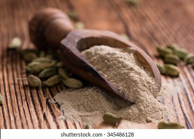 Cardamon Powder On Wooden Background (detailed Close-up Shot)