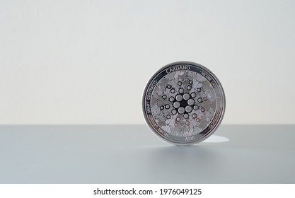 Cardano (ADA) Digital Crypto Currency. Stack Of Black And Silver Coins. Cyber Money