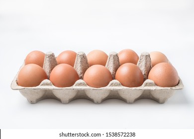 cardboard box with brown chicken eggs
