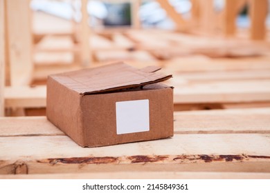 Cardboard box with construction nails or self-tapping screws, blank marking sticker
