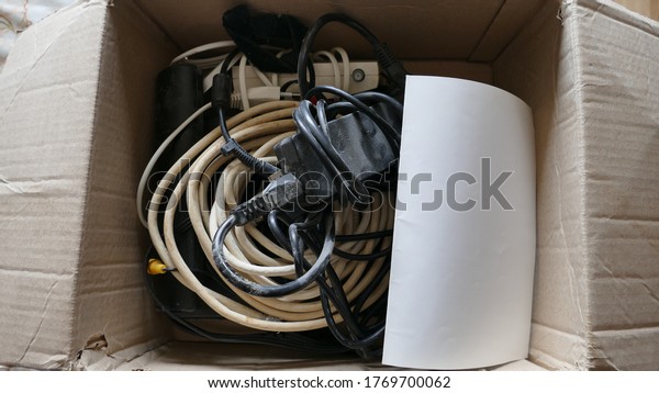 cardboard box with electrical\
wires