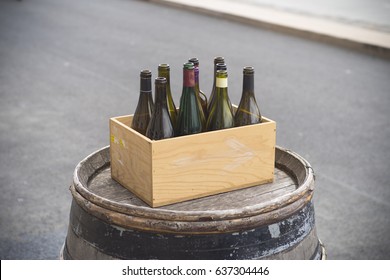 cardboard box with empty wine bottles 