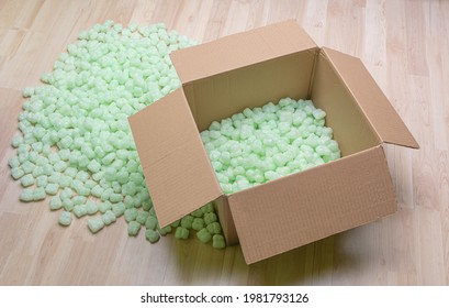 Cardboard Box Filled With Styrofoam Peanuts. 