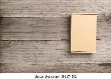 Cardboard Box On A  Wooden Background