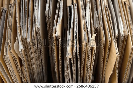 cardboard box, stack of folded corrugated cardboard boxes neatly arranged, brown packaging carton box, representing recycling, packaging, eco, and sustainable resource use