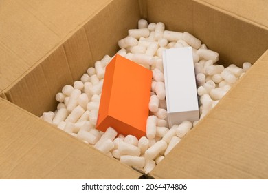 Cardboard box with styrofoam filler for safe packaging. Gift package - Shutterstock ID 2064474806