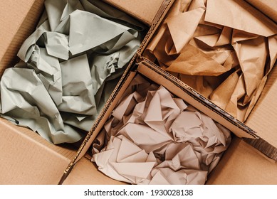 Cardboard boxes with crumpled paper inside for packaging goods from online stores, eco friendly packaging made of recyclable raw materials - Shutterstock ID 1930028138