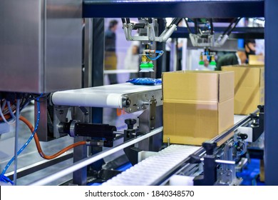 cardboard boxes on conveyor belt. parcels transportation system concept - Powered by Shutterstock