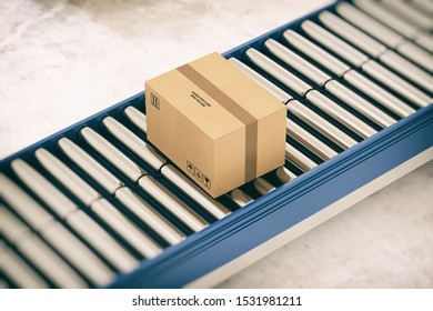 Cardboard boxes on conveyor rollers ready to be shipped by courier for distribution - Shutterstock ID 1531981211
