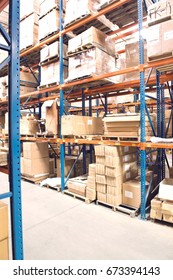 Cardboard Boxes On Shelves In Distribution Warehouse