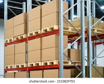 Cardboard boxes on warehouse shelves. Steel racks with pallets. Warehouse of distribution company. Warehouse logistics manufacturing enterprises concept. Concept renting place to store company goods - Shutterstock ID 2153829701