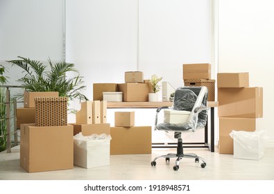 Cardboard Boxes And Packed Chair In Office. Moving Day