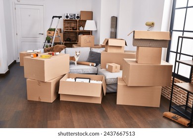 Cardboard boxes piled in an apartment, indicating moving day with a small dog standing amidst the chaos. - Powered by Shutterstock