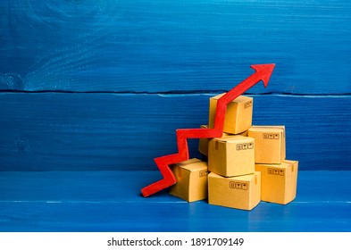 Cardboard Boxes And Red Arrow Up. Transformation Of The Economy And Trade Into Online Marketplaces, The Growth Of E-commerce And Online Shopping. Growing Business Activity. Rise In Price Of Goods.