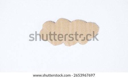 Cardboard cut into cloud shape isolated on white background
