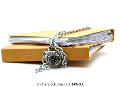 Cardboard Document Folders Locked With Chain And Padlock. Selective Focus With Shallow Depth Of Field.