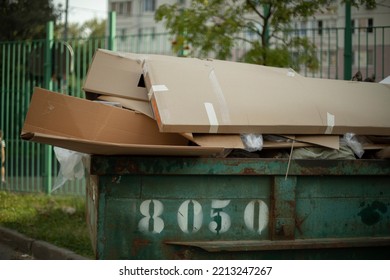 Cardboard In Dumpster. Garbage Can Outside. Discarded Cardboard. Infrastructure Details.