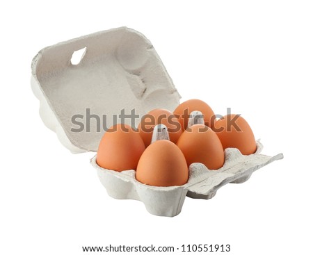 Cardboard egg box with six brown eggs isolated with clipping path