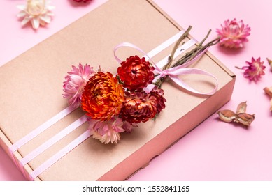 Cardboard Gift Box Decorated With Dried Flowers On Pink Backgrou