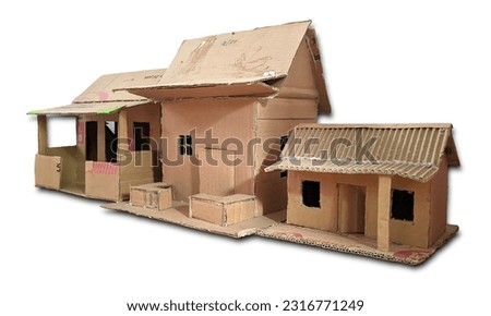 Cardboard house made by elementary school students isolated onwhite