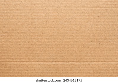 Cardboard sheet texture background, detail of recycle brown paper box pattern.