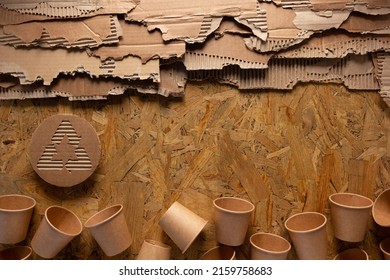 Cardboard Torn Edge At Chipboard Plywood Background Texture. Recycle Symbol And Product From Recycled Paper