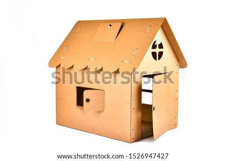 Cardboard toy house for children on white background. Eco-friendly Box for pet or carton playhouse