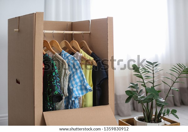 Cardboard Wardrobe Box Clothes On Hangers Stock Photo Edit Now