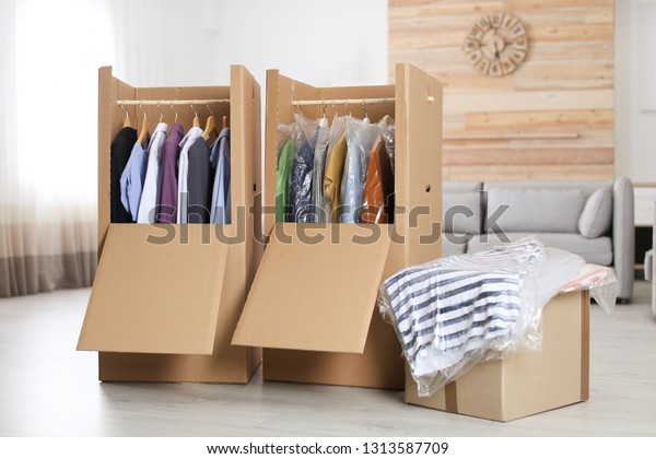 Cardboard Wardrobe Boxes Clothes On Hangers Stock Photo Edit Now