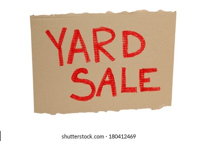 Cardboard yard sale sign on white background