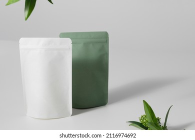 Cardboards packaging for tea and flowers on a white background. Blank tea packaging mockup with tea to demonstrate your branding design. High quality photo
