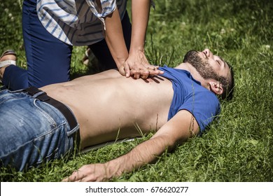 cardiac massage to an unconscious guy after injury