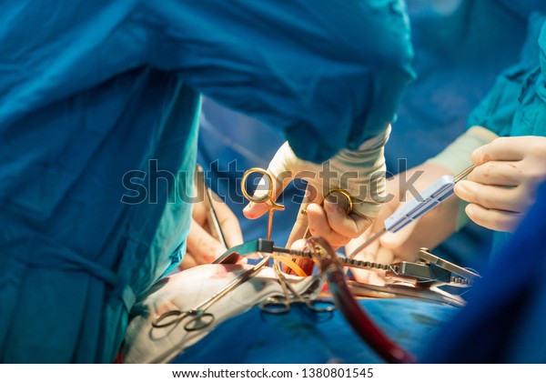 Cardiac surgery. Heart transplantation. Open\
heart surgery. Surgical instruments. Surgeon at work in the\
hospital. Open chest. Medical\
equipment