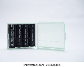 Cardiff Mid Glamorgan Wales UK May 08 2022 Green translucent plastic case holding four AA type rechargeable batteries  white background