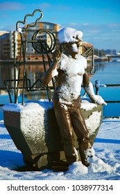 Cardiff, UK, December 18. 2010. From Pit To Port Sculpture Which Celebrates Welsh Coal Miners In Cardiff Bay With Snow, Wales