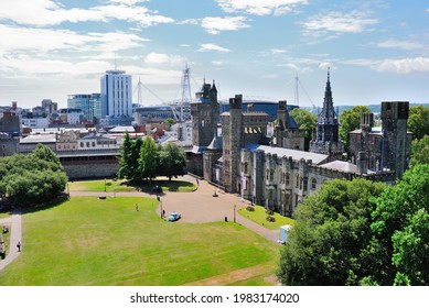Cardiff, UK – July 7, 2019 - Cardiff skyline with Victorian Gothic revival mansion and Cardiff Castle grounds seen from the Norman shell keep, located in the city center of Cardiff, Wales