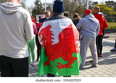 Cardiff, Wales - April 2021: Person Wrapped In A Welsh Flag In A Crowd Of People In Cardiff City Centre