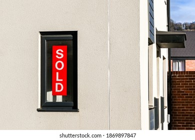 Cardiff, Wales - December 2020: Sold Sign In The Window Of A House On A New Housing Development On The Outskirts Of Cardiff.