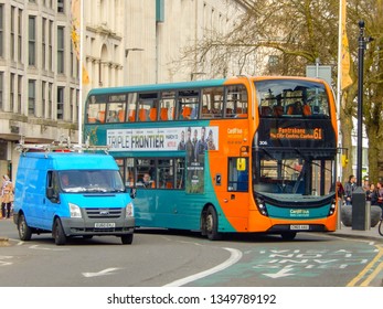 CARDIFF, WALES - MARCH 2019: Double Decker Bus Operated By Cardiff Bus Driving In A Bus Lane In Cardiff City Centre.