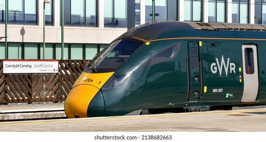 Cardiff, Wales - March 2022: Class 800 high speed train operated by Great Western railway at one of the platforms of Cardiff Central railway station. In the background is a station name sign.