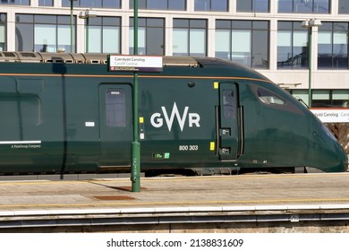 Cardiff, Wales - March 2022: Class 800 high speed train operated by Great Western railway at one of the platforms of Cardiff Central railway station. In the foreground is a station name sign.