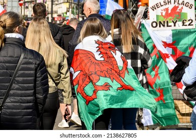 Cardiff, Wales - March 2022: Rugby Fan With A Welsh Flag Around His Shoulders In Cardiff City Centre