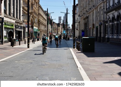 CARDIFF / WALES MAY 25 2020: COVID 19 Retail Sector Continues In Lockdown. High Street Is Empty, Shops Closed, Just Cyclists Using The Desolate Roads And Precincts For Exercise. 