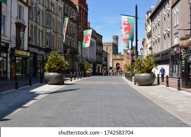 CARDIFF / WALES MAY 25 2020: COVID 19 retail sector continues in lockdown, the roads are empty, shops closed, just cyclists using the desolate roads and precincts for exercise. 
