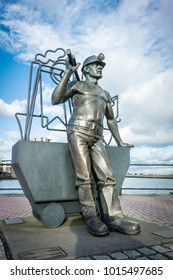 CARDIFF, WALES, UK, JANUARY 2015 - Bronze Statue Of A Coal Miner In Cardiff Bay, Wales, UK