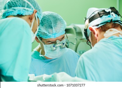 Cardio Surgery Operating Room. Male Cardiac Surgeon In Hospital