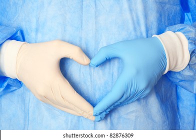 Cardiologist In Blue And White Gloves Saving Life Of All His Patients